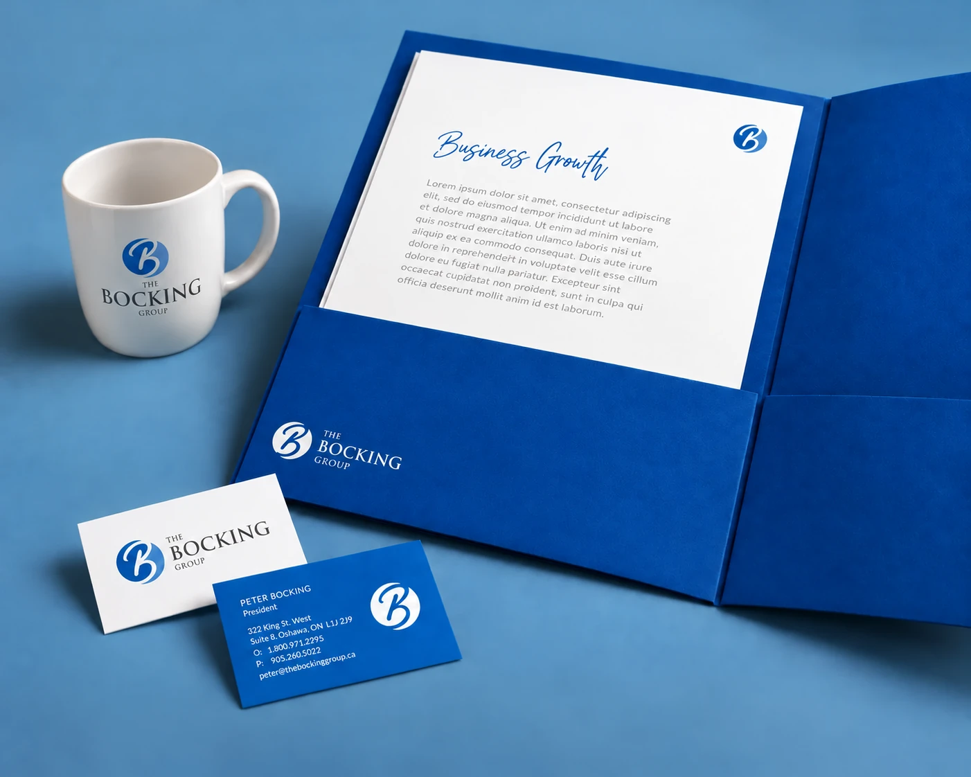 The Bocking Group mug, folder and business cards in a portrait brand showcase